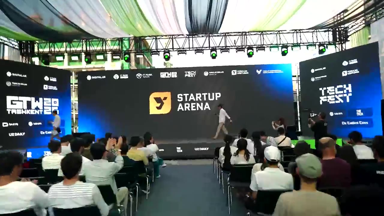 Attendees watching the Startup Arena stage at GTW Tashkent